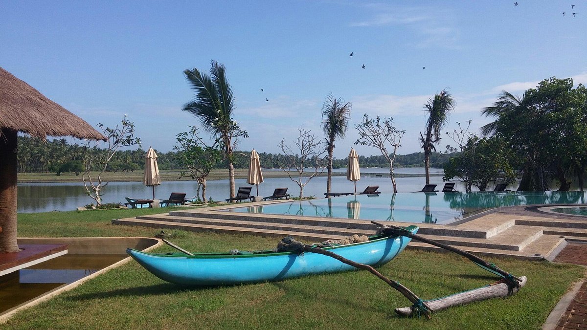 Uppuveli Beach near Amaranthé Bay, Trincomalee; Guest canoeing on the lagoon at Amaranthé Bay